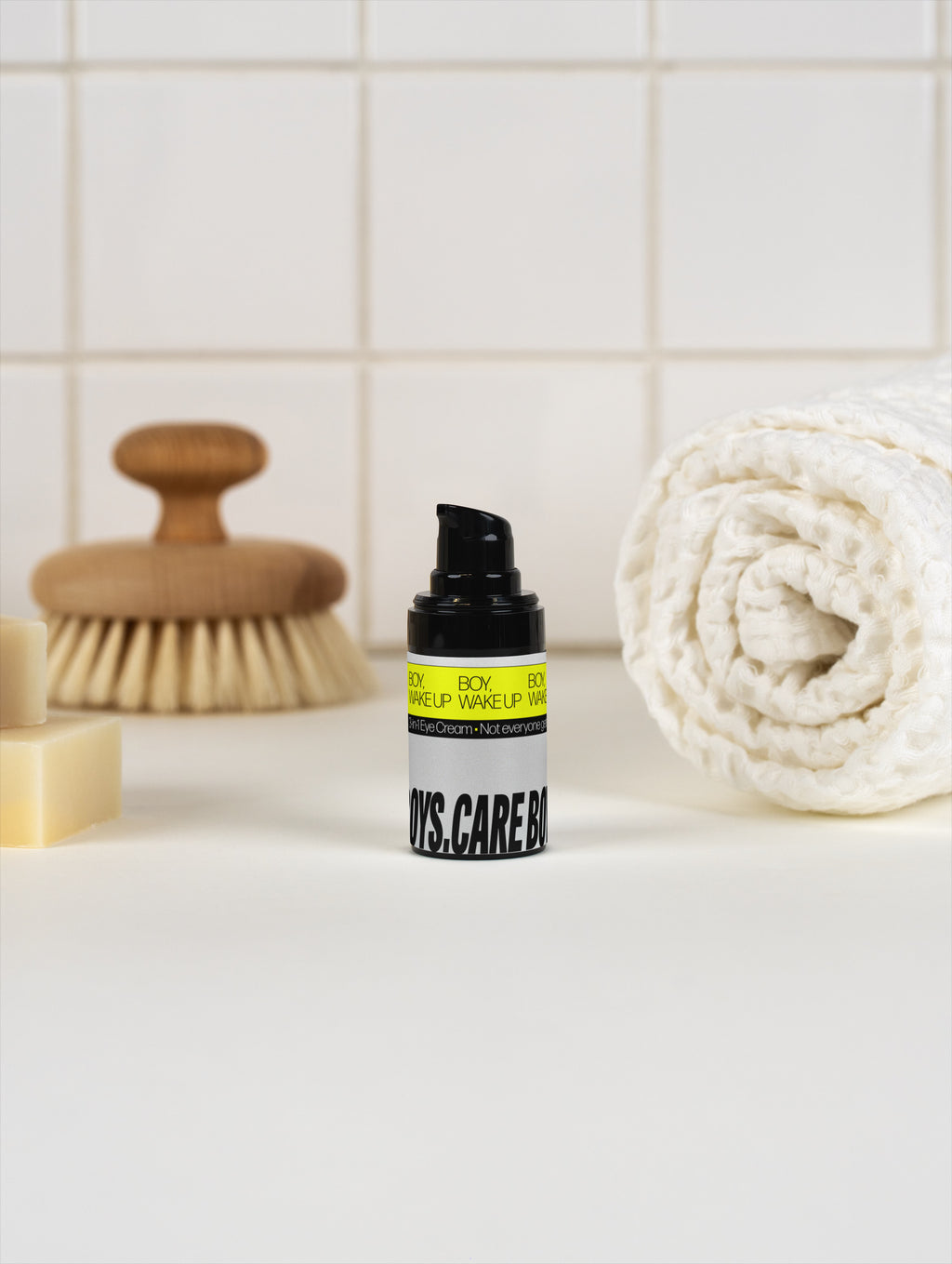 BOY, WAKE UP eye cream in a bathroom.